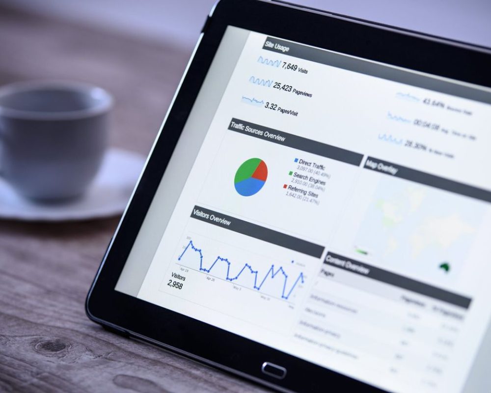 tablet with charts visuals and graphs showing information